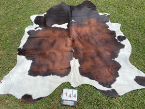 a144. Black White Reddish Cowhide