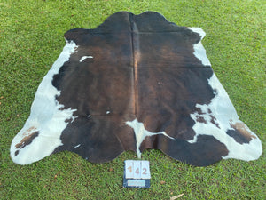 a142. Black white reddish Cowhide