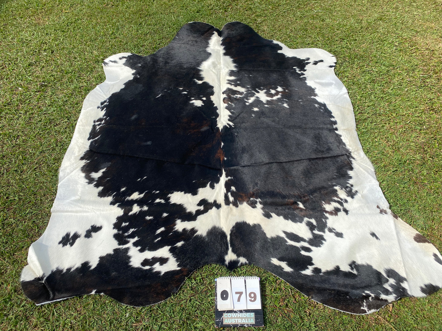 79. Black white reddish Cowhide