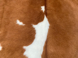 a175. Tan white Cowhide