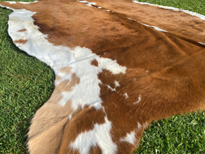 76. Brown white Cowhide