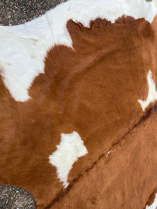 46. Brown White Cowhide