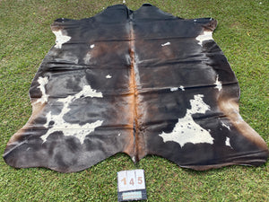 a145. Black white reddish speckled Cowhide