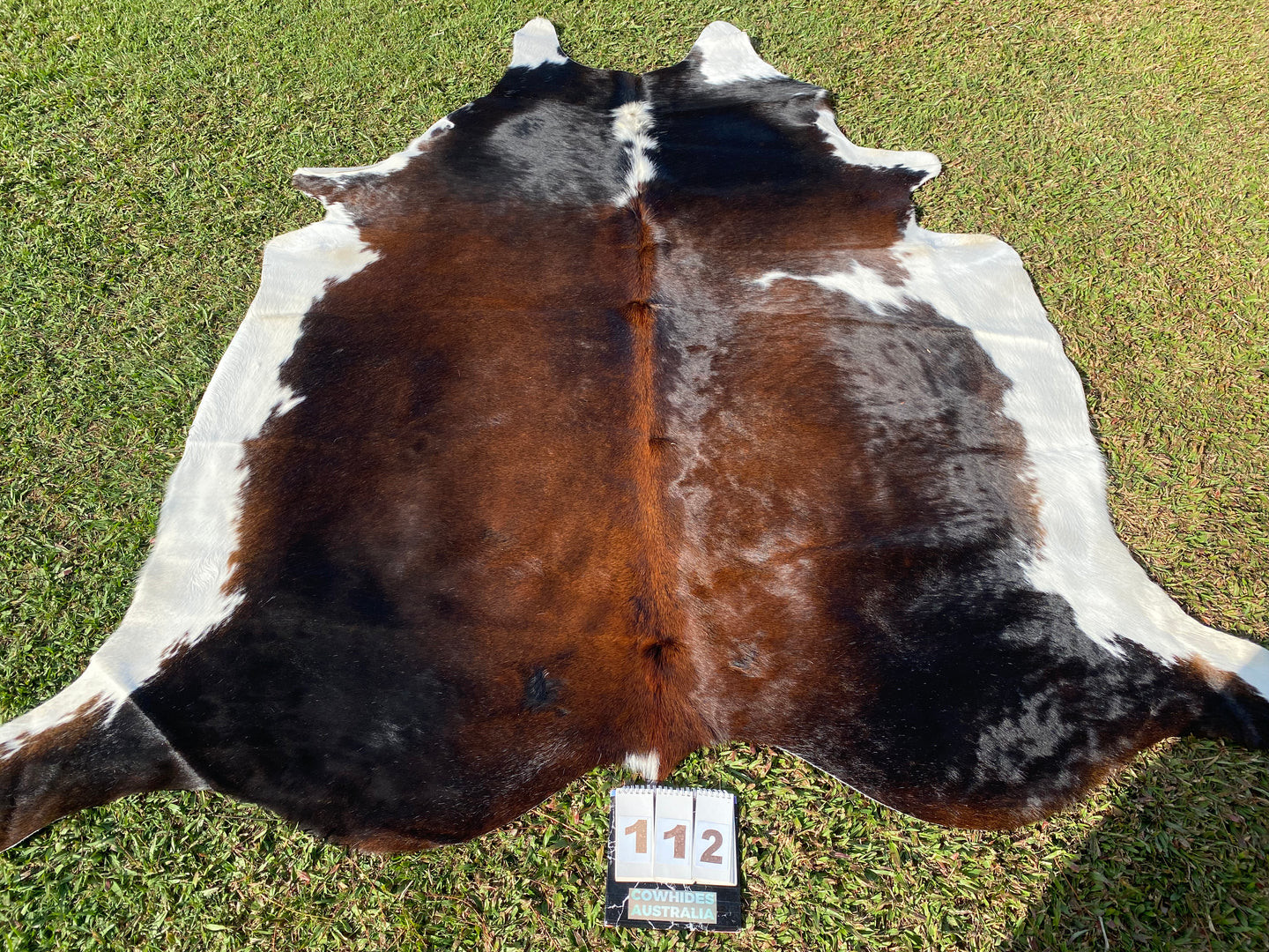 a112. Black white reddish Cowhide