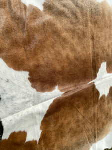 a166. Brown white Cowhide