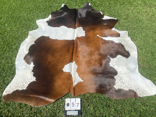 57. Black White Reddish Cowhide