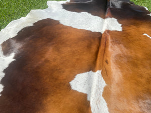 57. Black White Reddish Cowhide