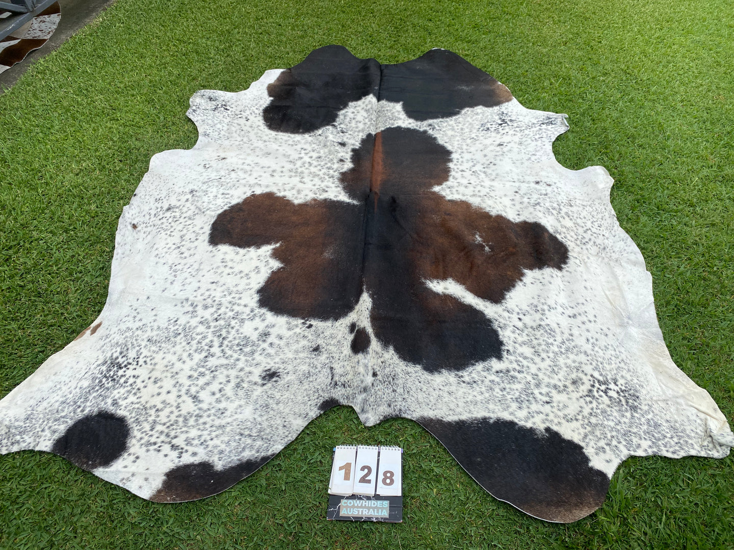 a128. Black white reddish Cowhide