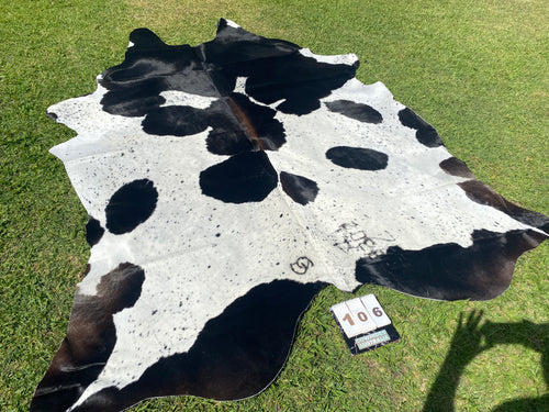 a106. Black white reddish  Cowhide