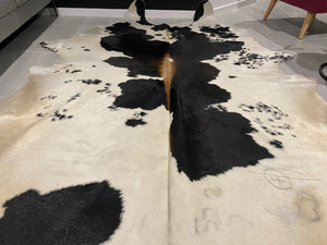 27. Black and White with Red Cowhide