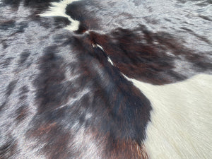 88. Black white reddish  Cowhide