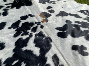 84. Black white reddish Cowhide