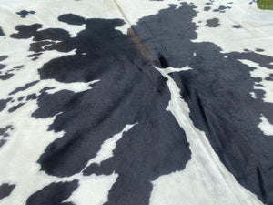 43. Black white reddish Cowhide