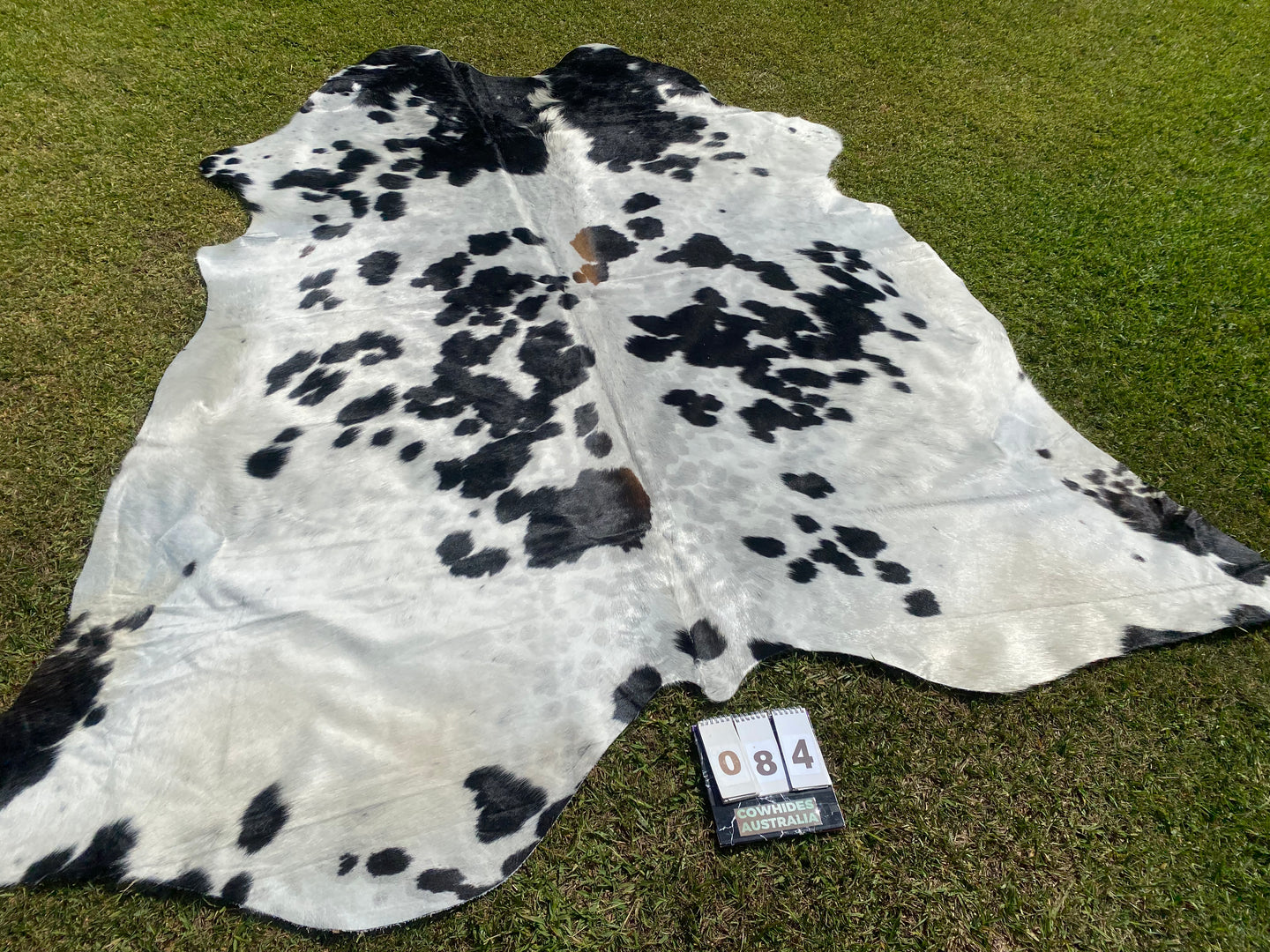 84. Black white reddish Cowhide